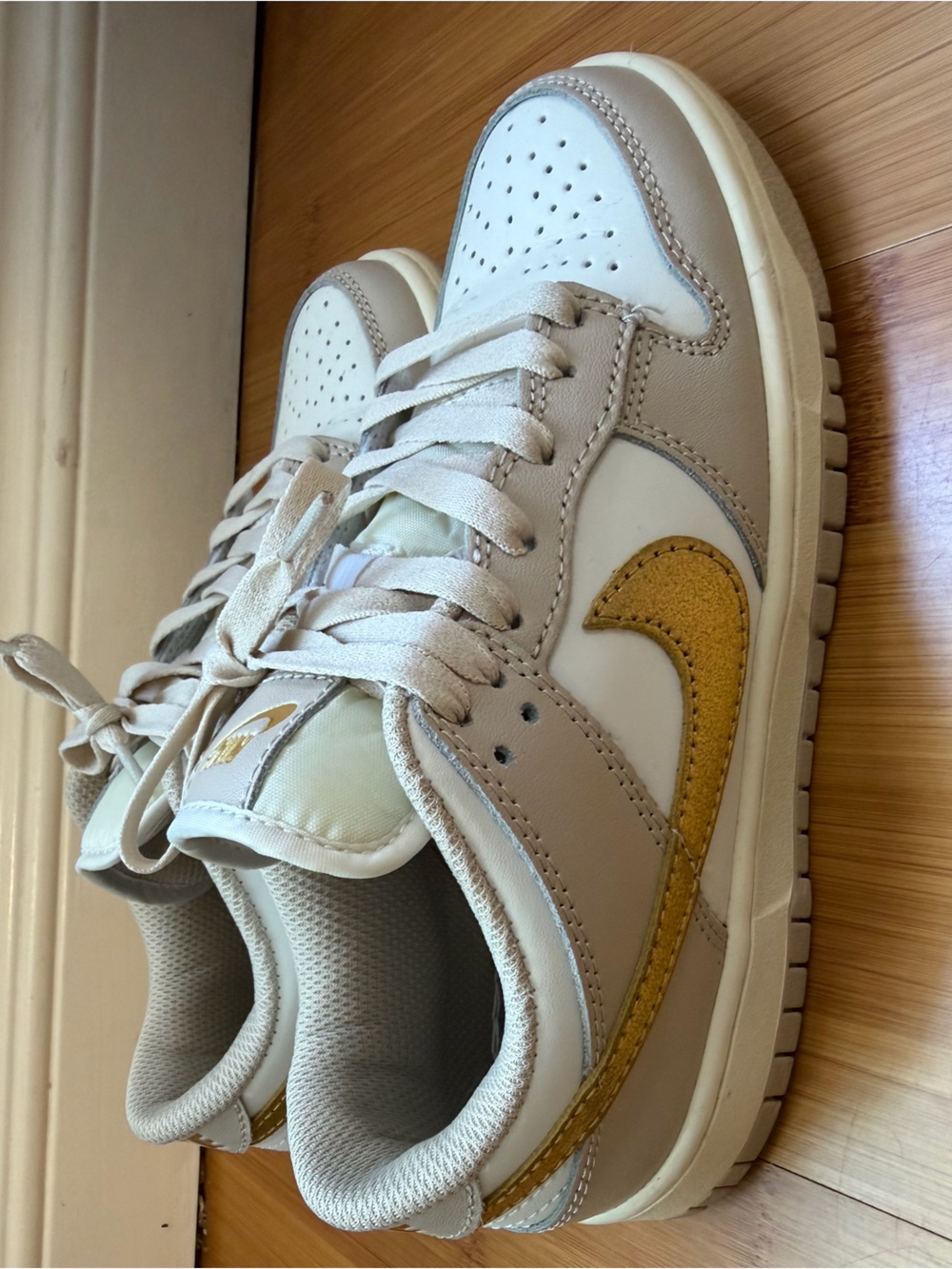 Nike Dunks Neutral Low-Top Sneakers with Gold Swoosh